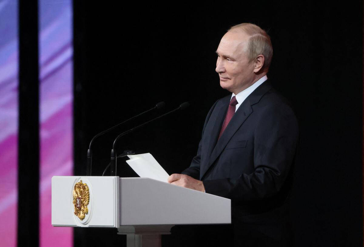 President Vladimir Putin Delivering Speech From The Podium Wallpaper