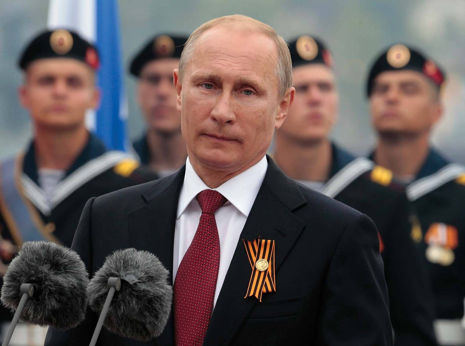 President Vladimir Putin Engaged In A Serious Gaze With The Camera. Wallpaper