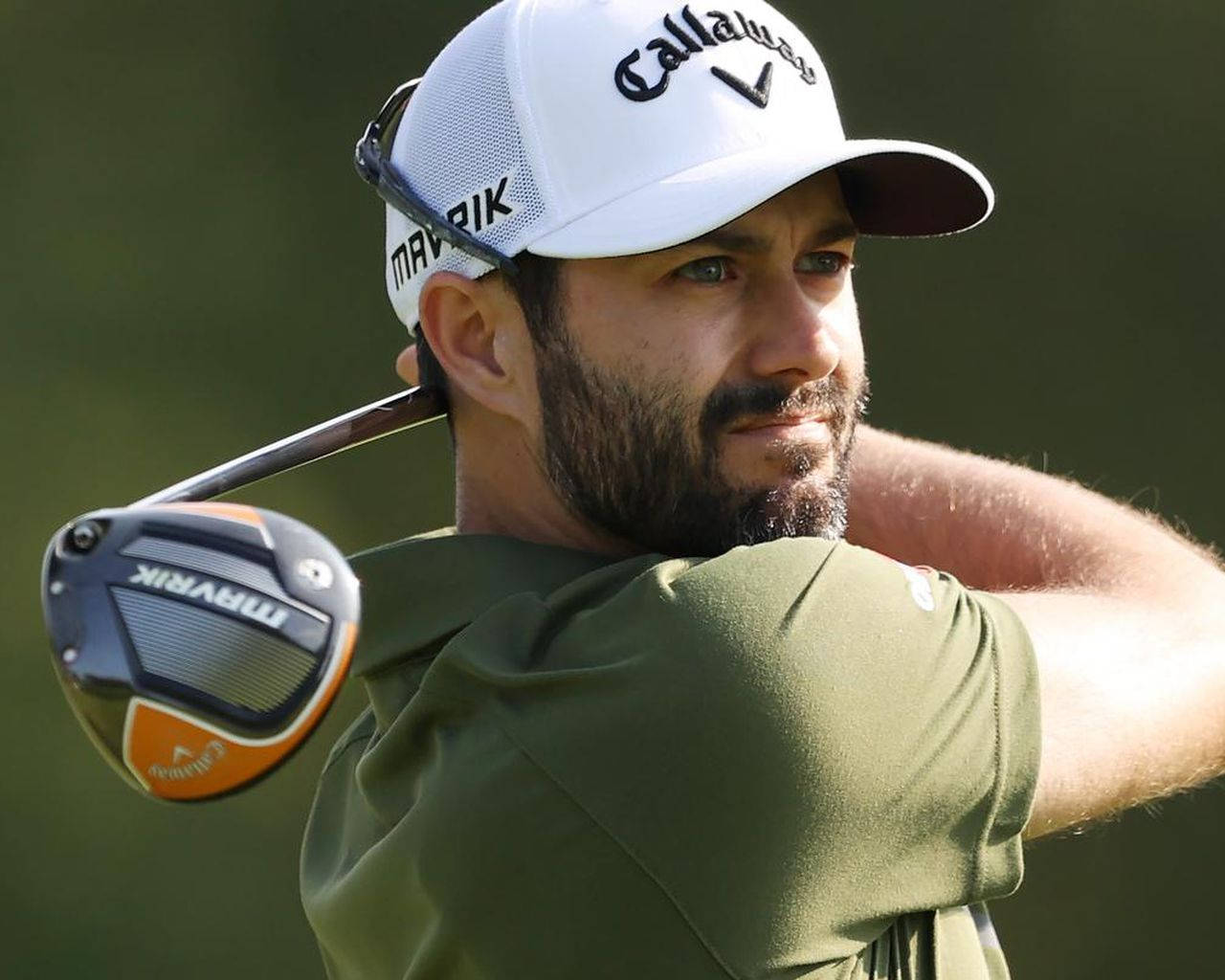 Professional Golfer Adam Hadwin Swinging On Course Wallpaper