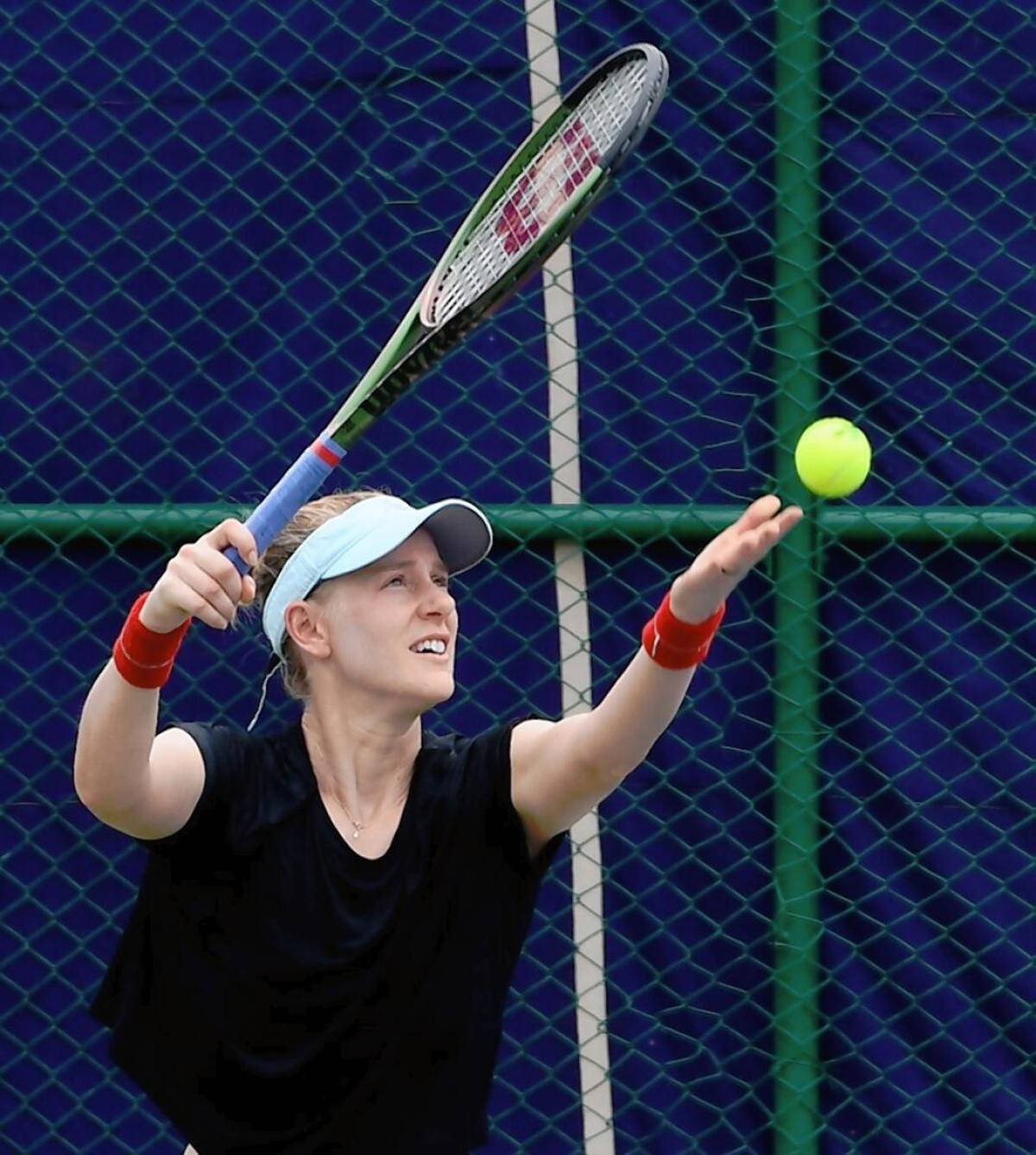 Professional Tennis Player Alison Riske-amritraj Performing A Service Wallpaper