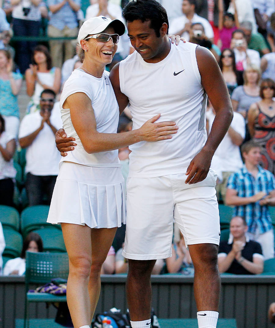 Professional Tennis Players Cara Black And Leander Paes In Action Wallpaper