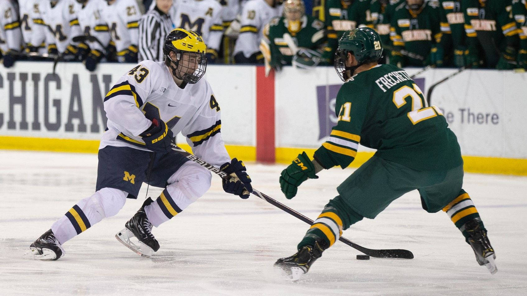 Quinn Hughes Dribbling Against Player From University Of Vermont Wallpaper