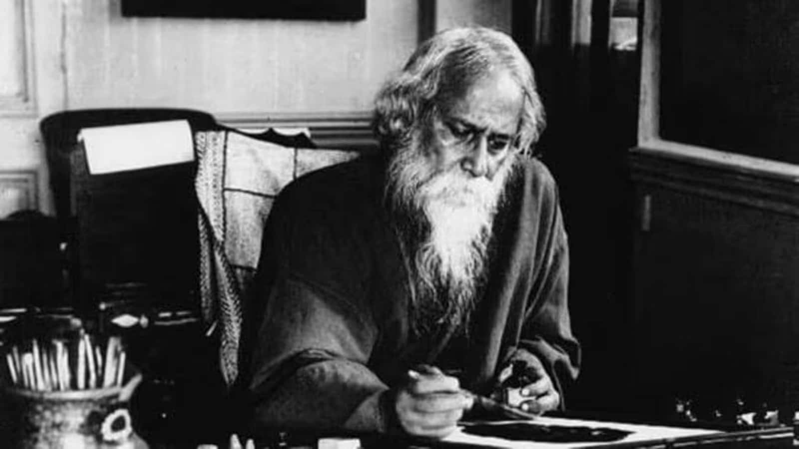 Rabindranath Tagore Writingat Desk Wallpaper