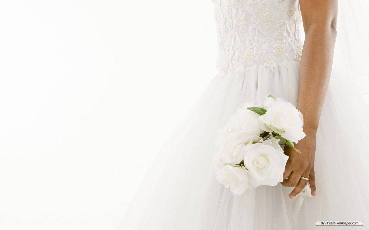 Radiant Bride In Stunning Wedding Gown Wallpaper