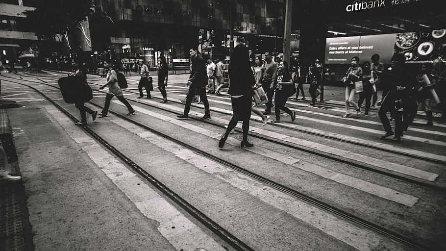 Random People Walking On Pedestrian Lane Wallpaper