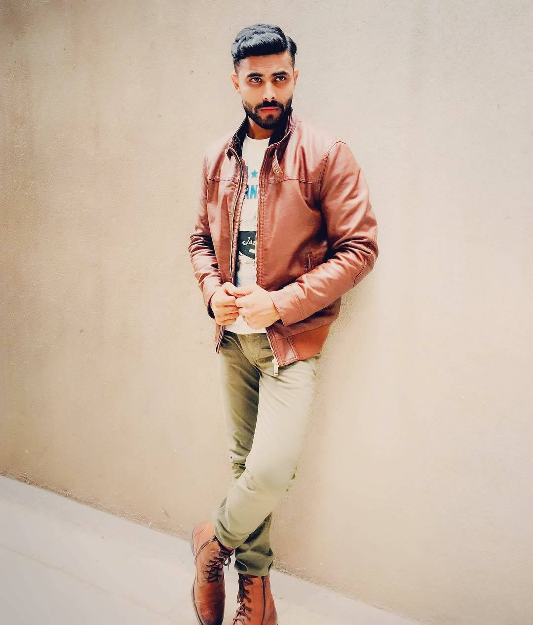 Ravindra Jadeja Looking Dapper In Jacket And Boots Wallpaper
