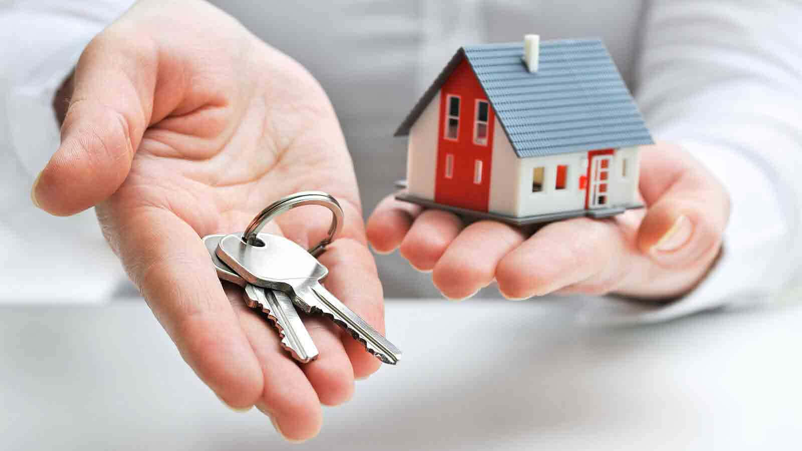 Real Estate Agent Holding House Keys Wallpaper