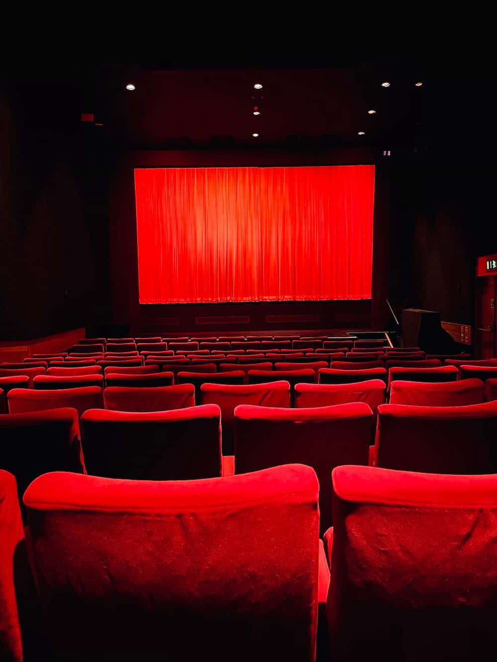 Red Cinema Hall Empty Seats Wallpaper
