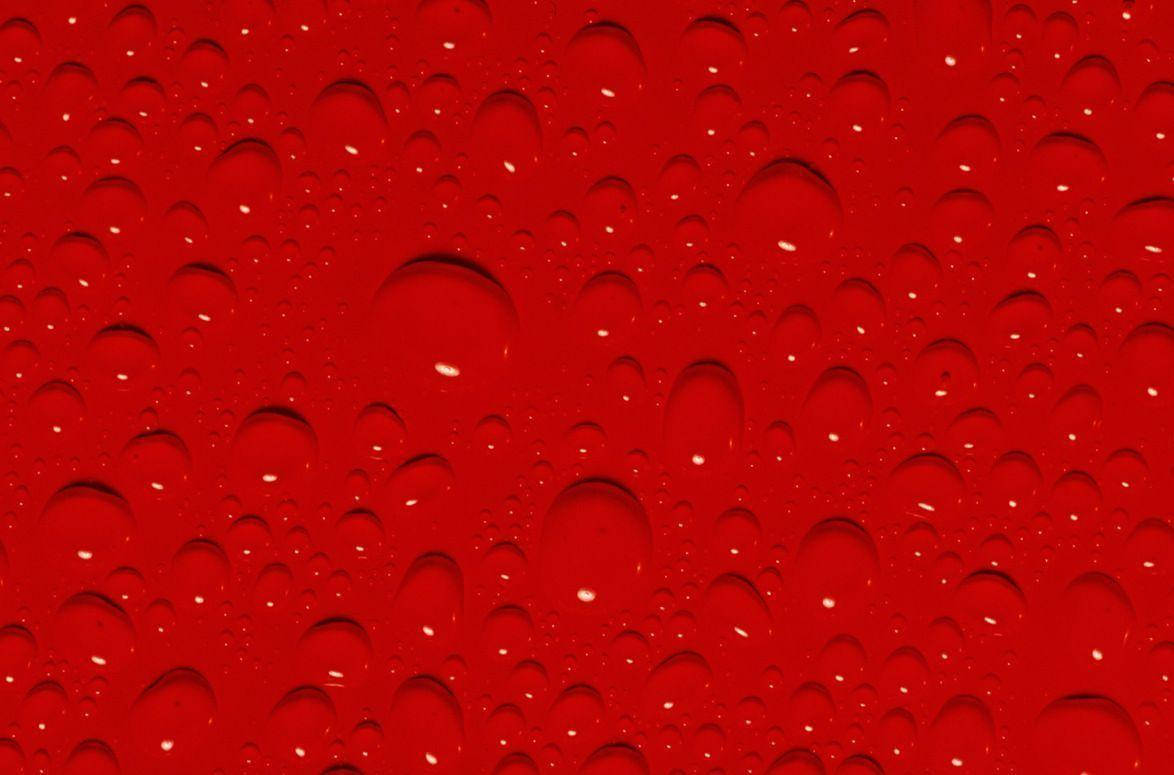 Red Color Surface With Drops Wallpaper