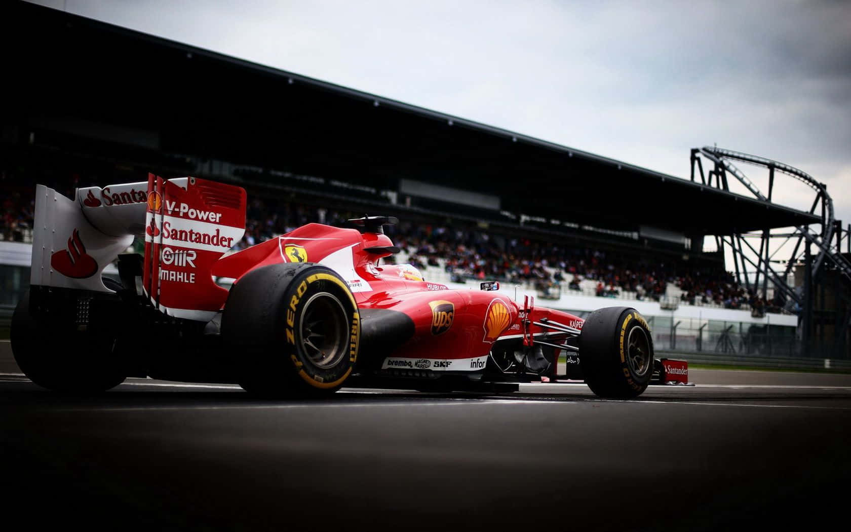 Red Ferrari F1 Car Dominating The Track Wallpaper