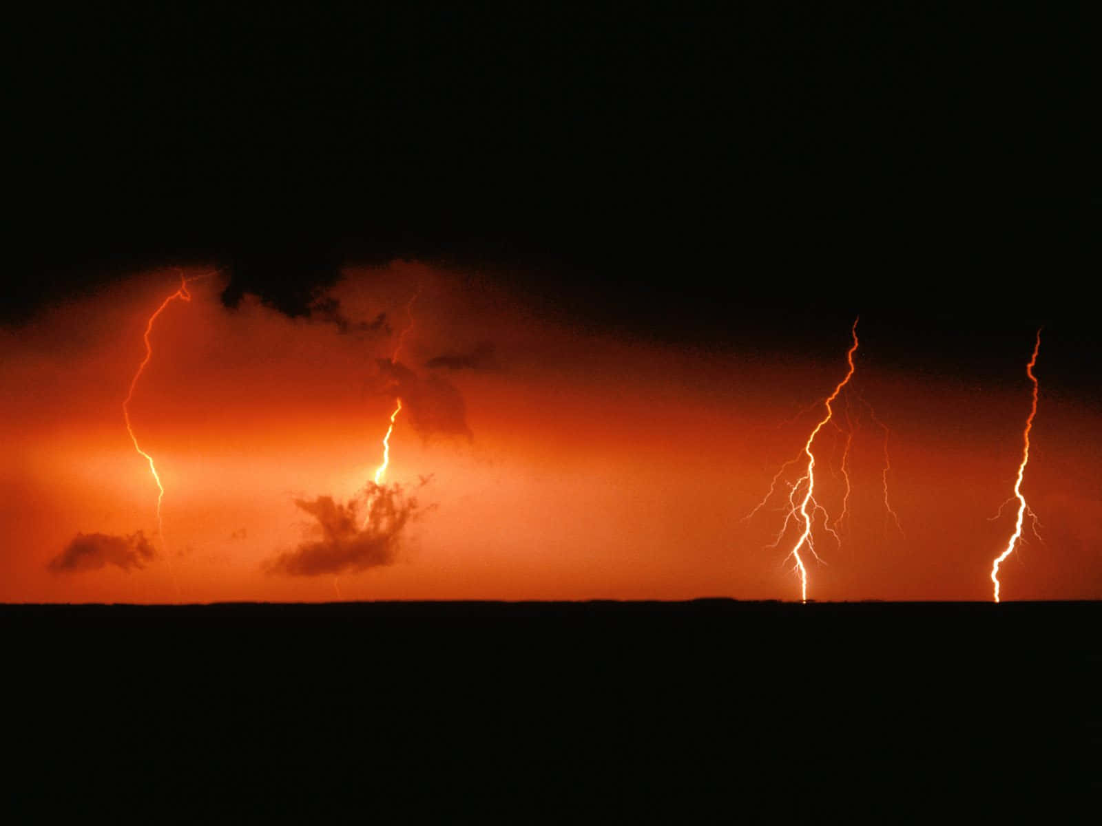 Red Lightning Strikes Over Ocean Wallpaper