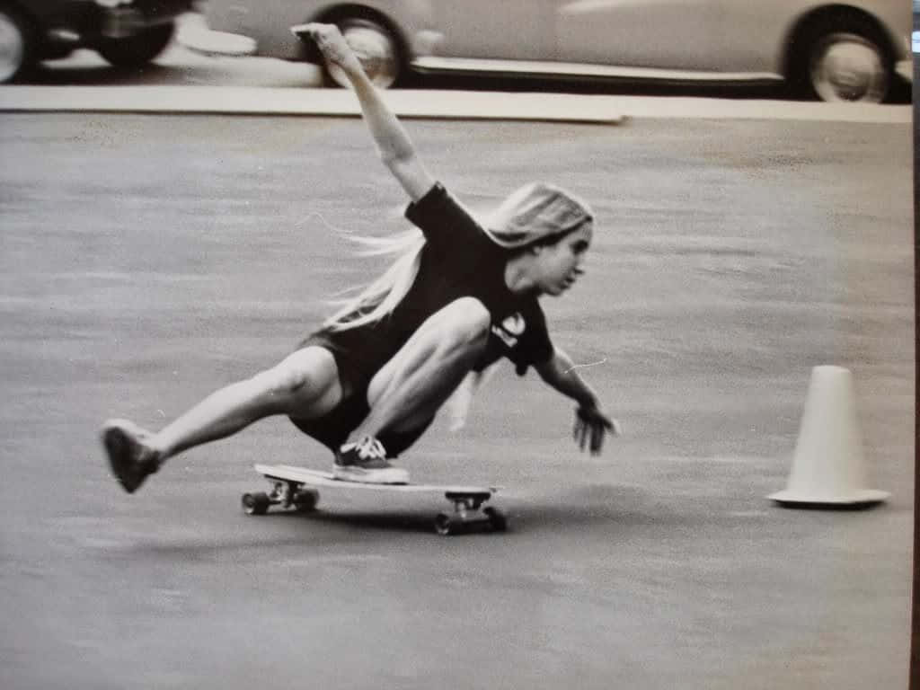 Retro Skateboard Girl Tricks Wallpaper