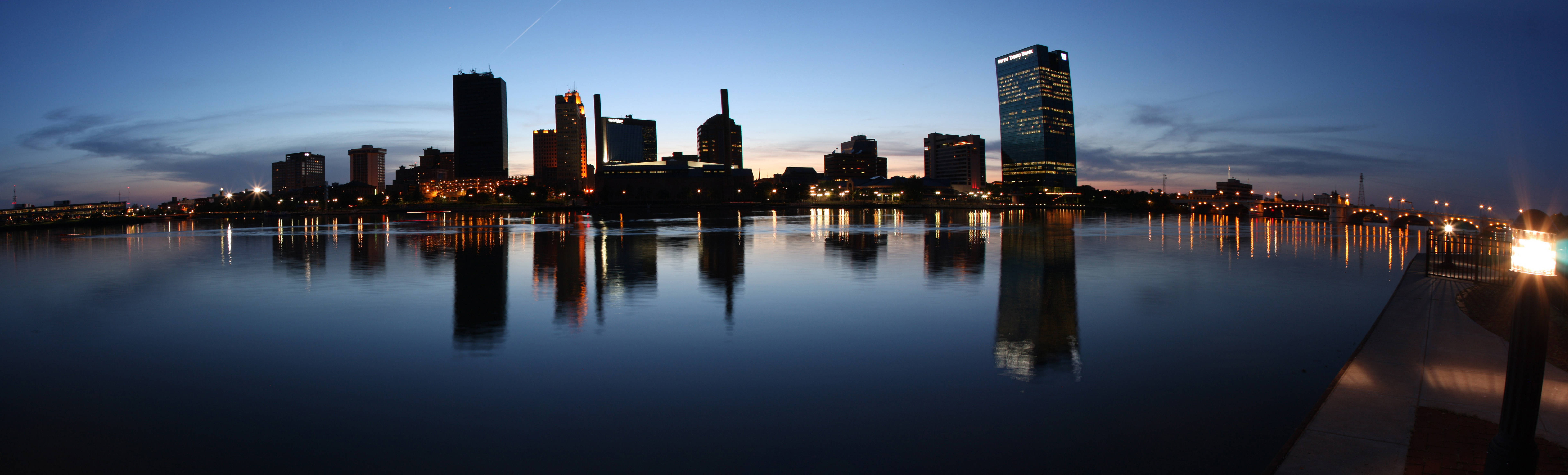 Riverfront Toledo Cityscape At Night Wallpaper