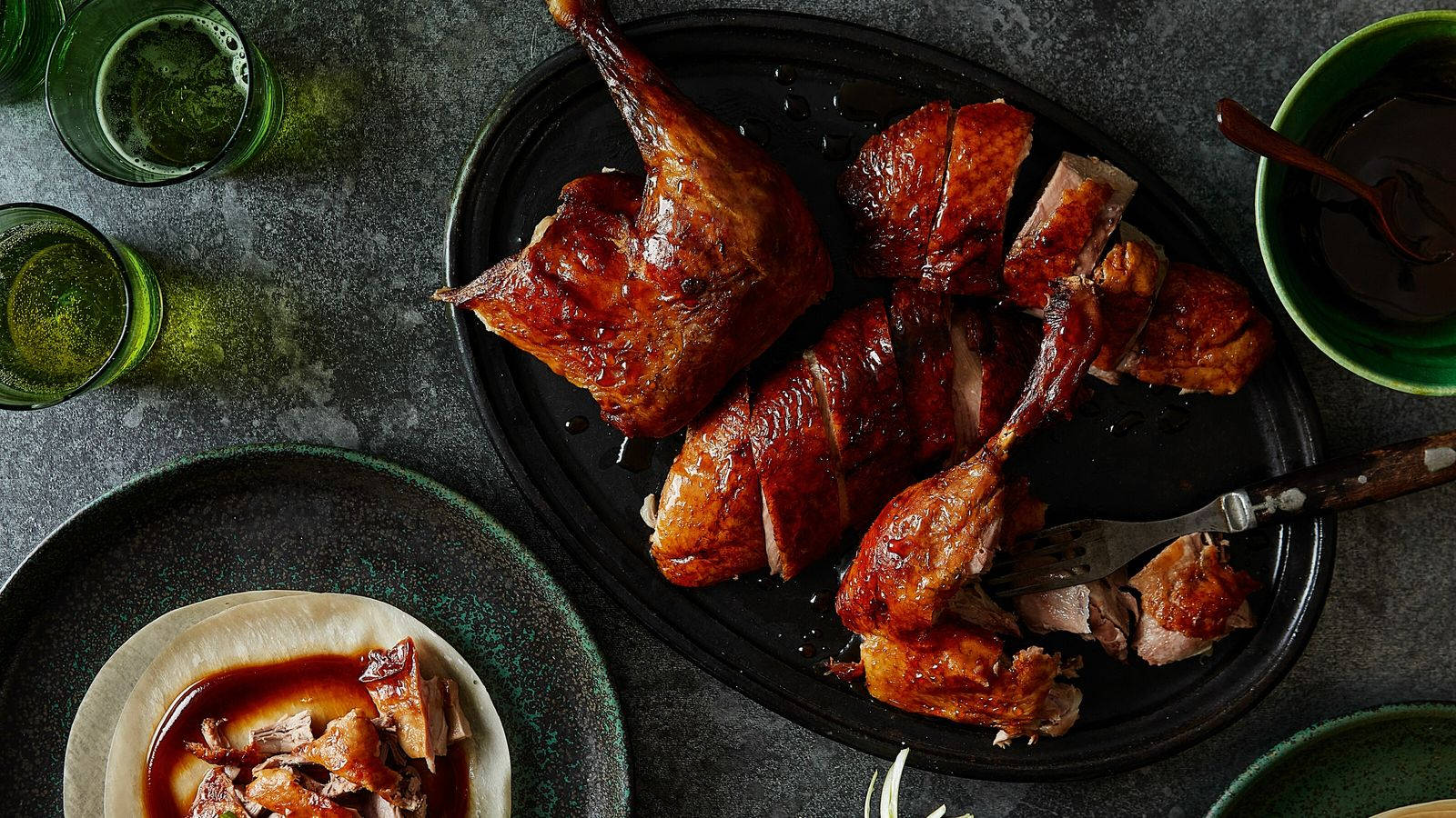 Roasted Peking Duck Pieces On Black Plate Wallpaper