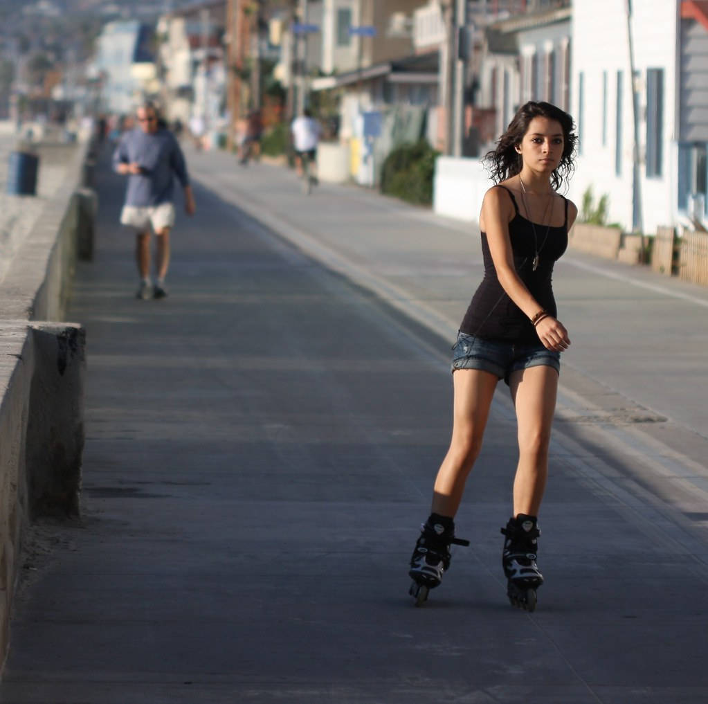 Rollerblading In The Boardwalk Wallpaper