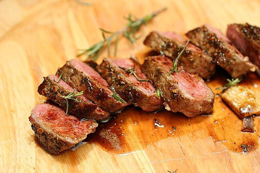 Rosemary With Medium Rare Steak Slices Wallpaper