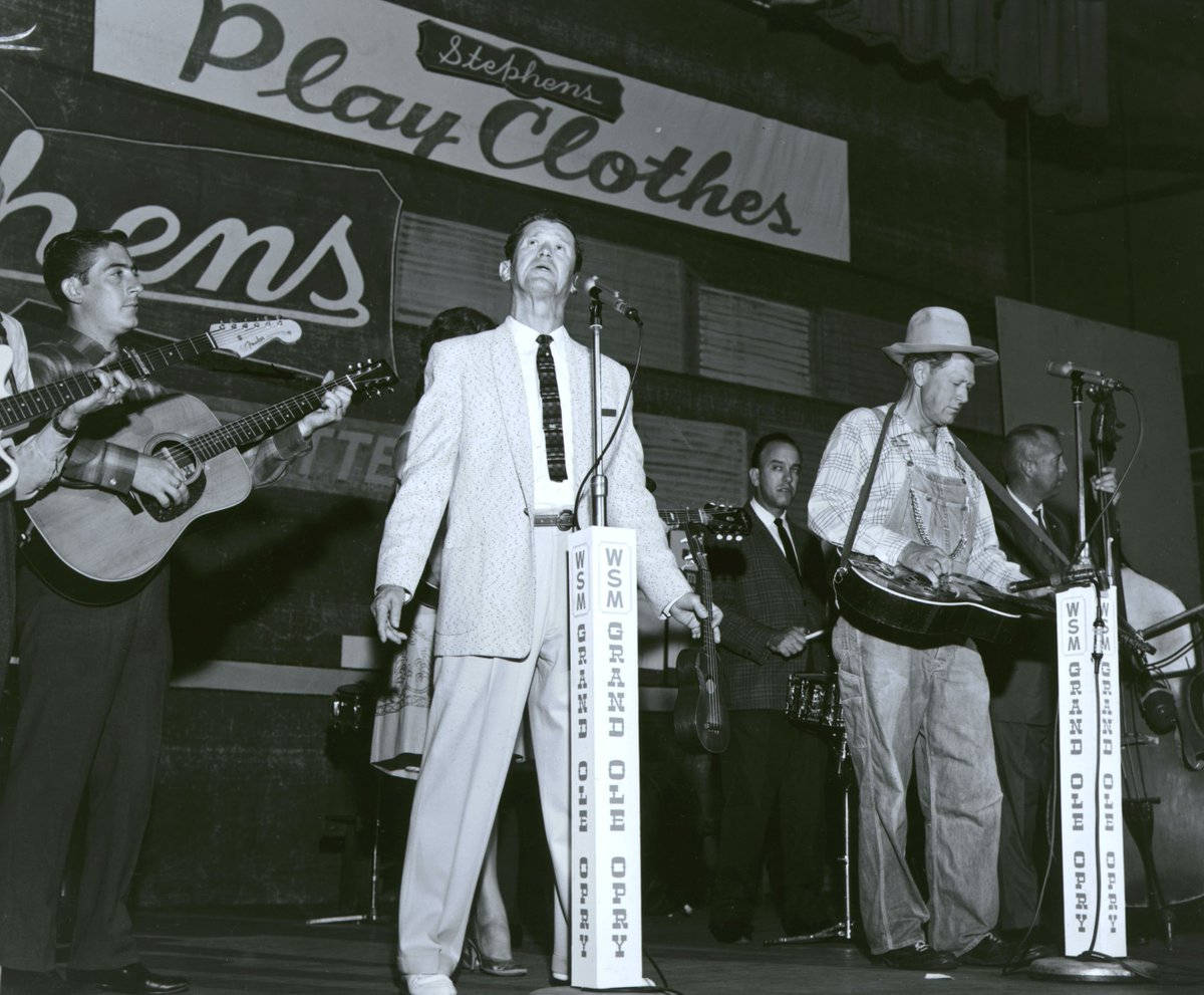 Roy Acuff Singing In Grand Ole Opry Wallpaper