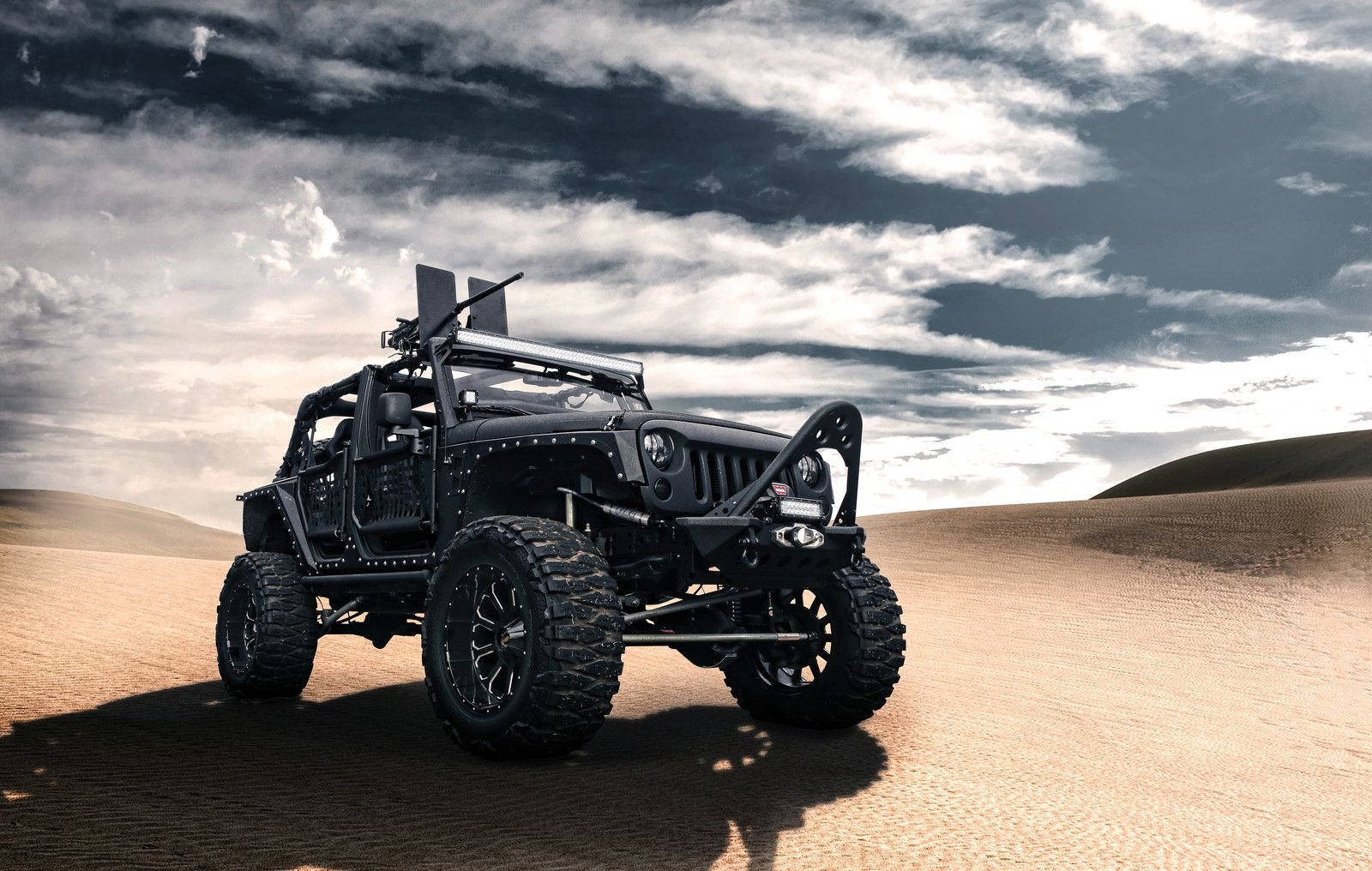 Rugged Black Jeep In The Wilderness Wallpaper