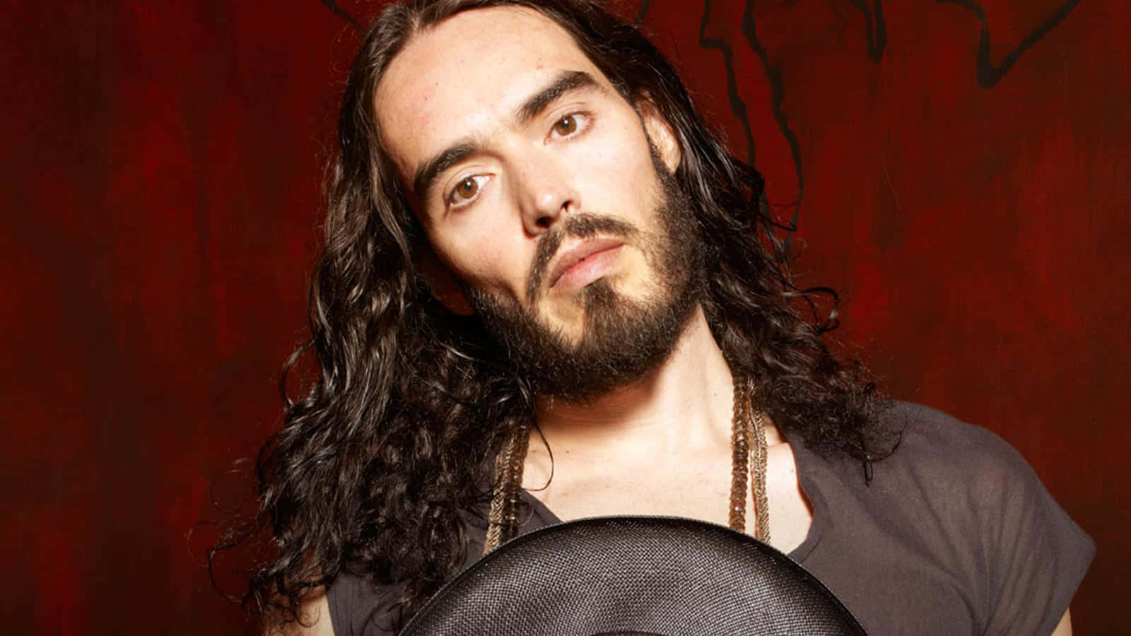 Russell Brand - The Pioneering Genius Of Comedy Wallpaper