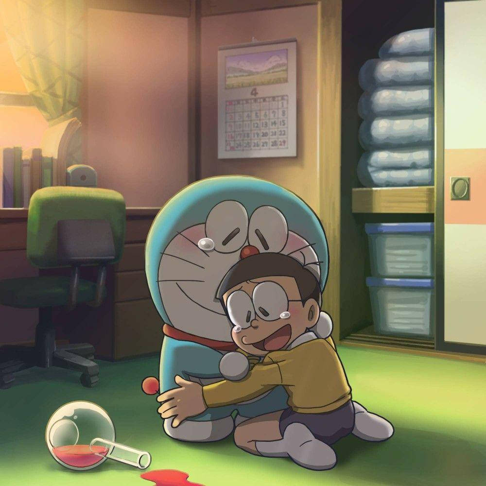Sad Nobita And Doraemon Hugging On Floor Wallpaper
