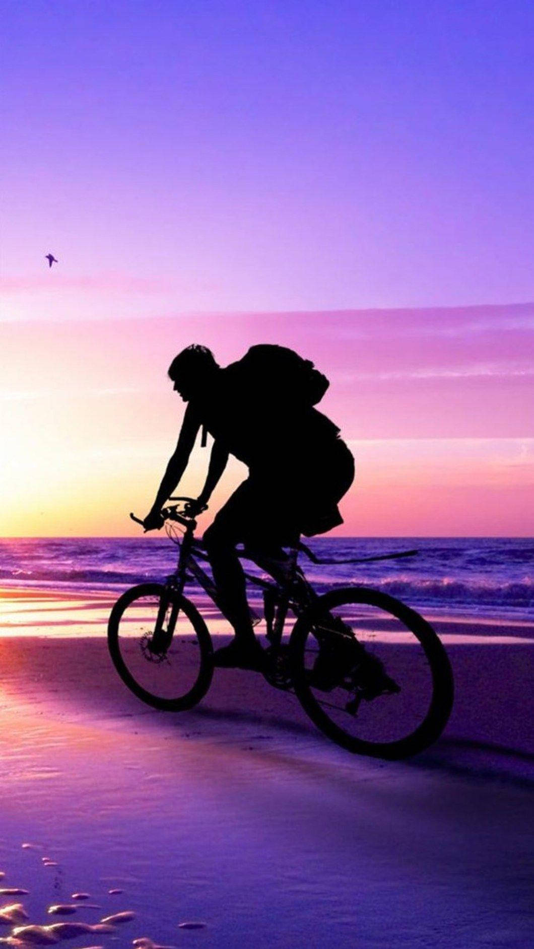 Scenic Bike Ride On The Beach Wallpaper