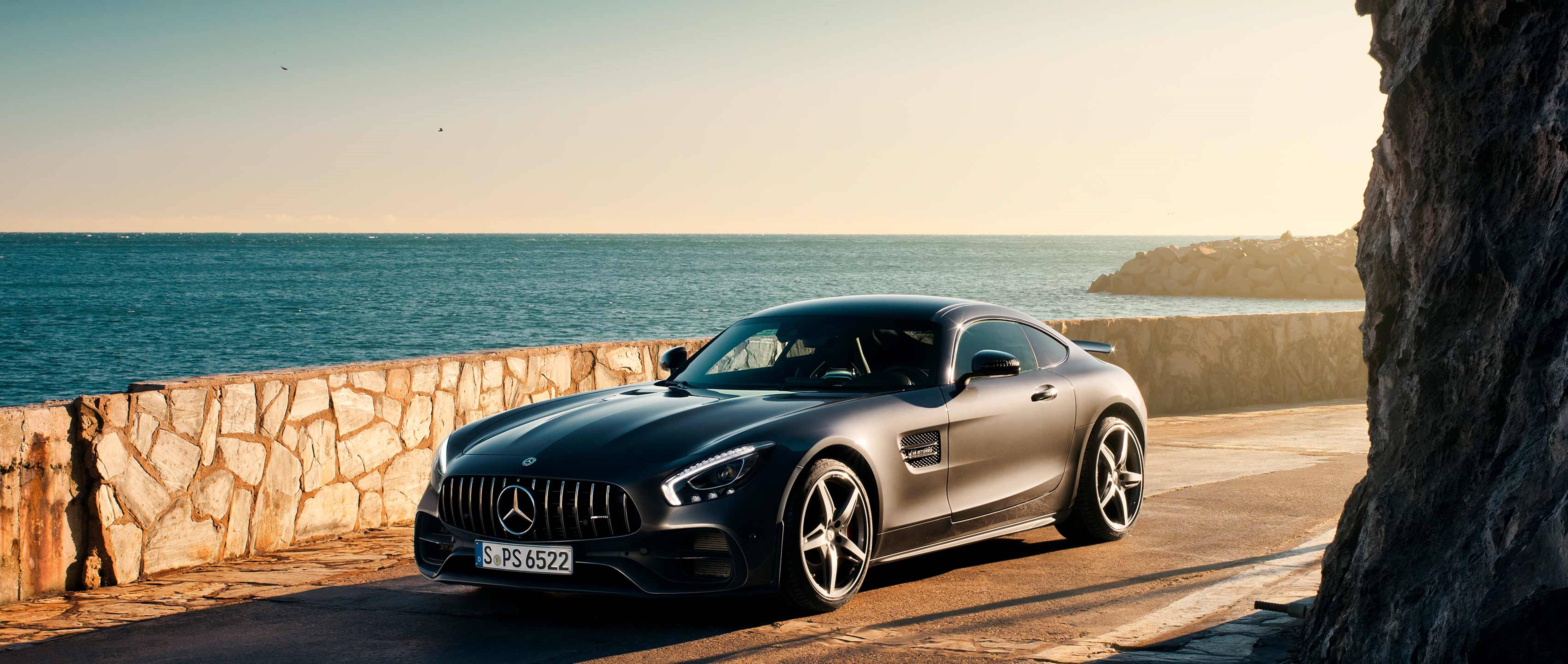 Sharp And Luxurious - Mercedes Amg On Open 4k Road By The Breathtaking Sea Side View. Wallpaper