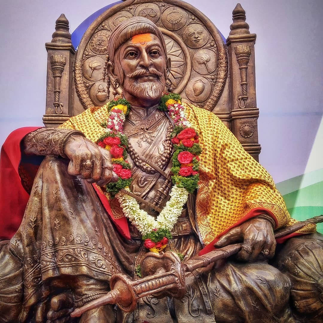 Shivaji Maharaj Statue Sitting With Hand On Knee Wallpaper