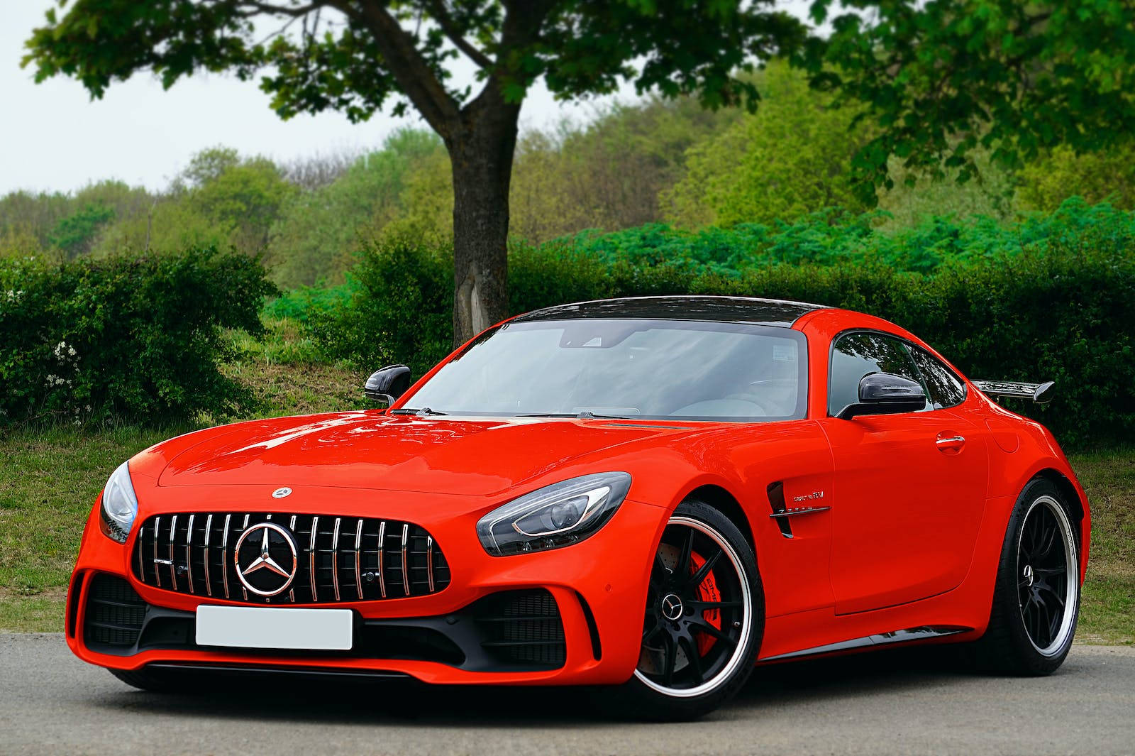 Showcasing Speed And Elegance: Red Mercedes-amg Gt Luxury Car Wallpaper