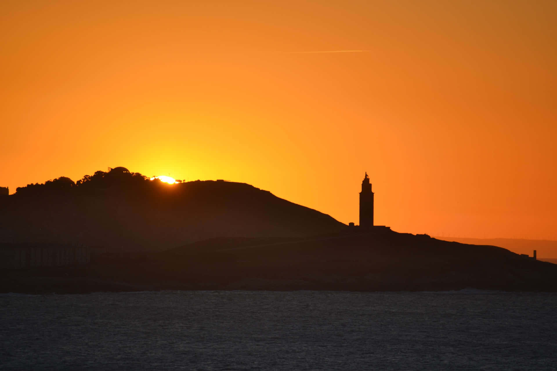 Silhouette Of Tower Of Hercules Orange Sunset Wallpaper