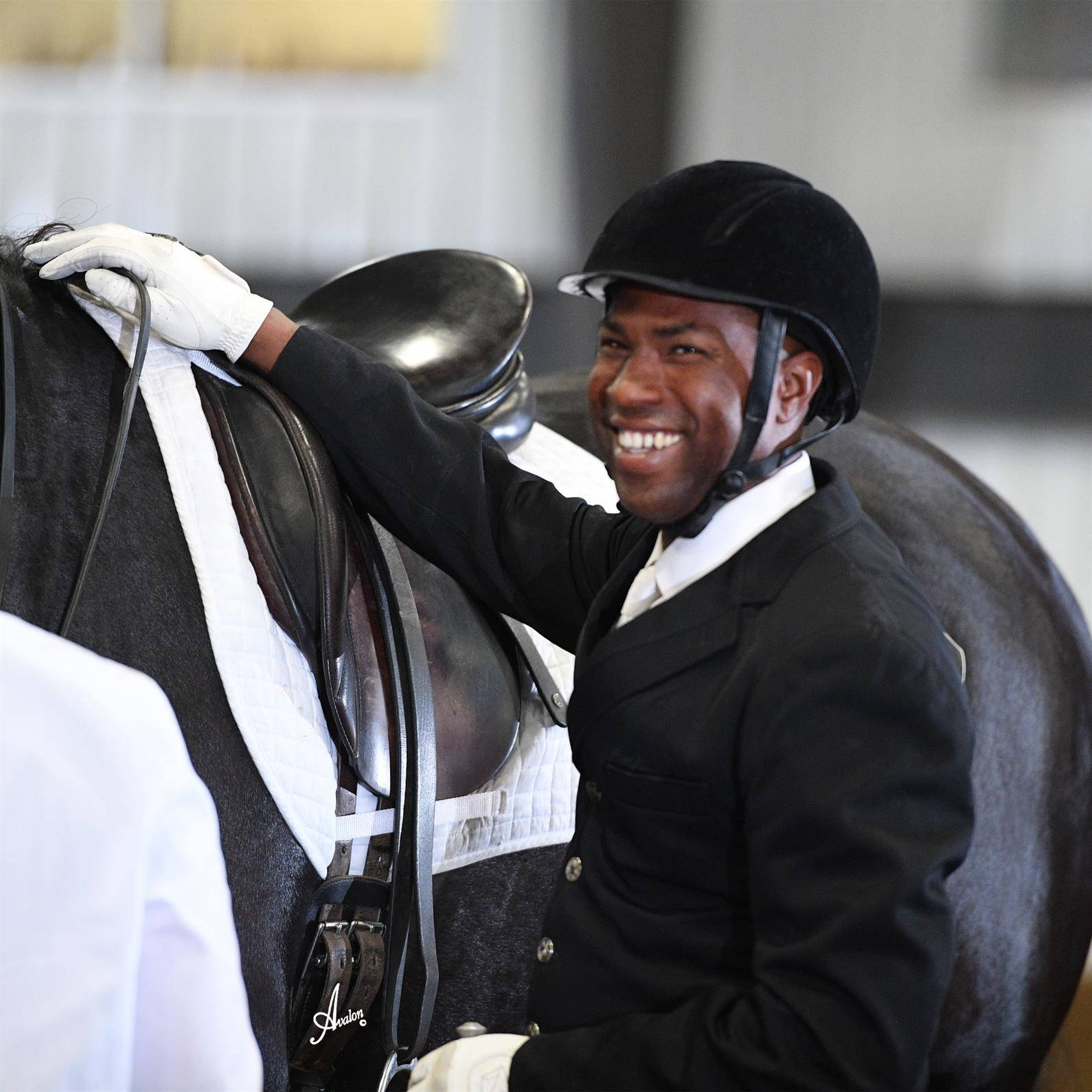 Skilled Equestrian Demonstrates Control And Partnership Wallpaper