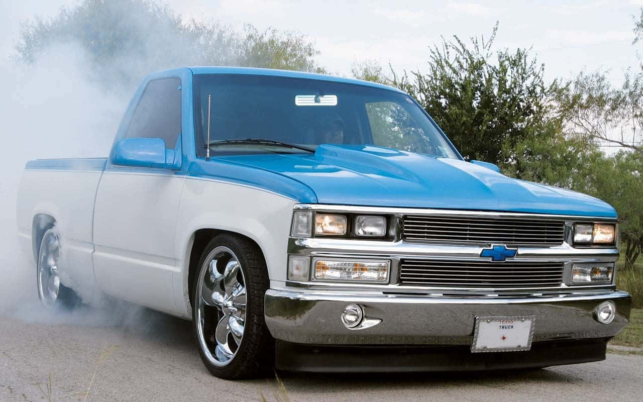 Sleek Low Truck Gliding On The Open Road Wallpaper