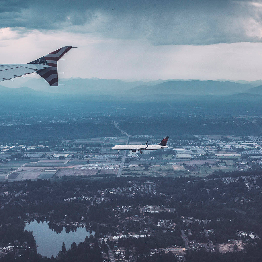 Small Plane Over The City Wallpaper