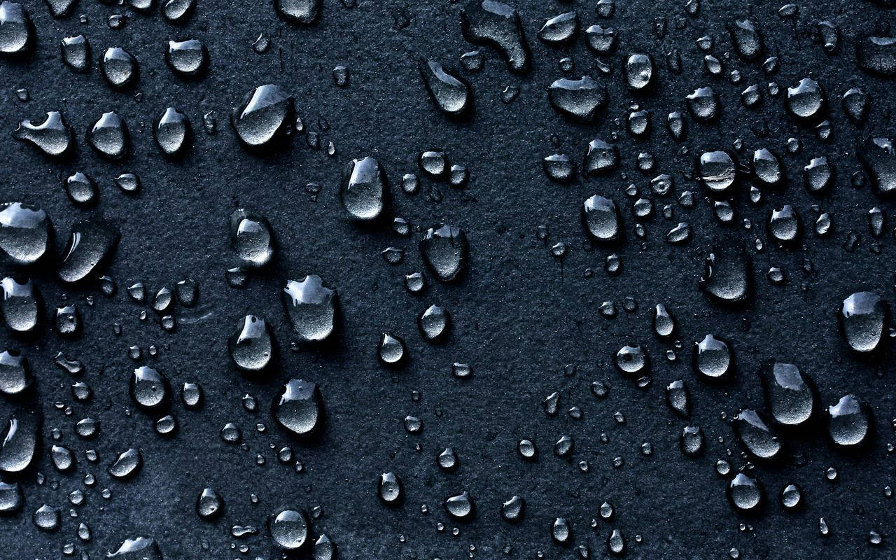 Small Raindrops On Black Surface Wallpaper