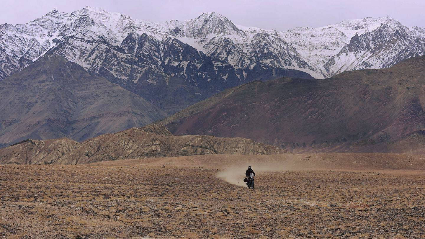 Solitary Himalayan Bike Rider Wallpaper