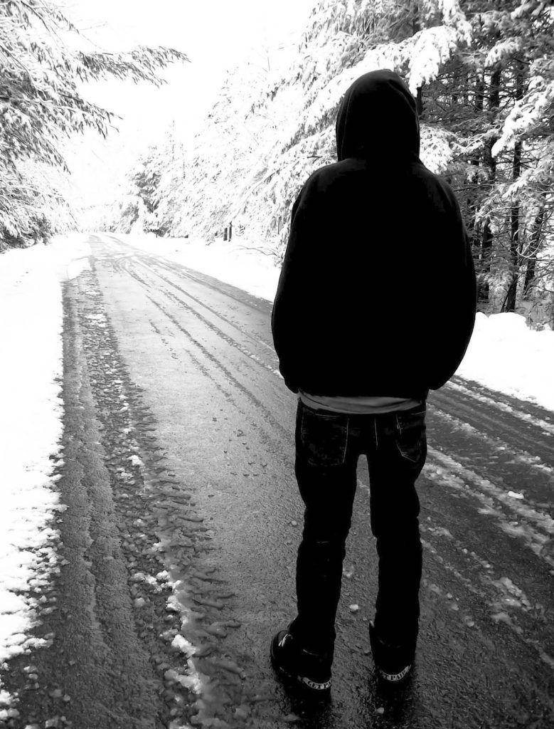 Solitary Journey - A Lone Boy Wandering Wallpaper