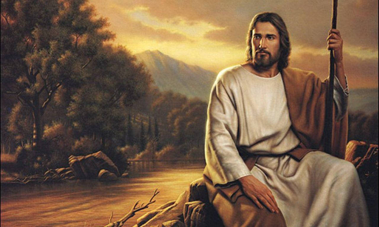 Son Of The Christian God Resting By River Wallpaper