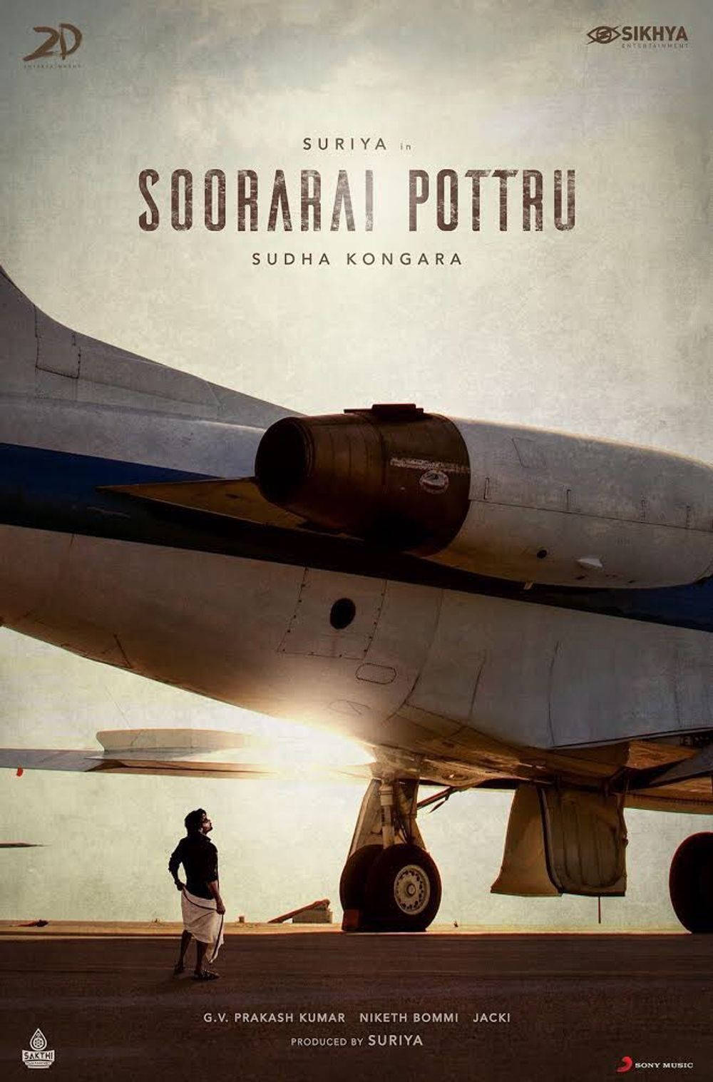 Soorarai Pottru - Suriya Standing Under An Airplane Wallpaper
