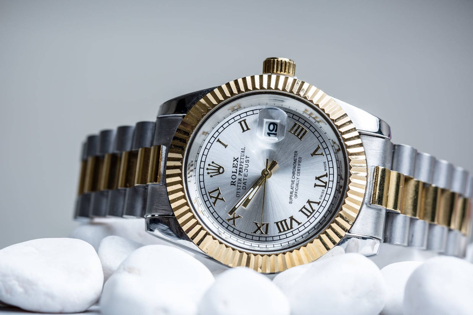 Sophisticated Silver And Gold Rolex - The Definition Of Luxury Wallpaper