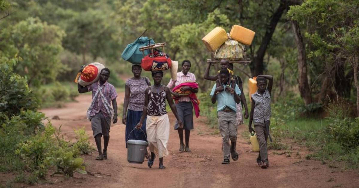 South Sudan People Carrying Down Road Wallpaper