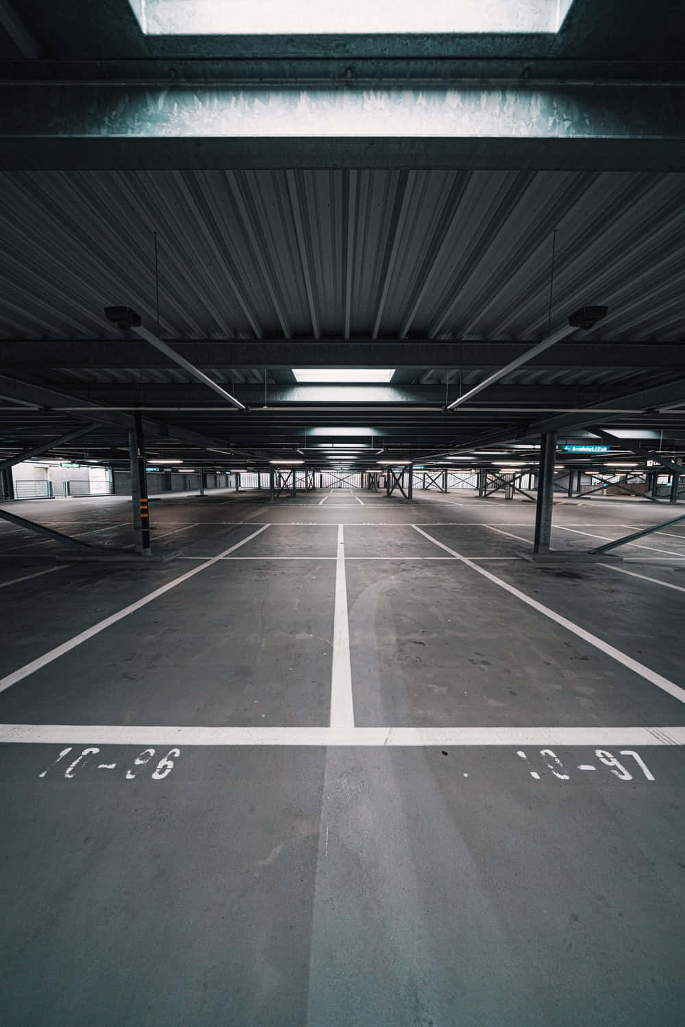 Spacious Underground Metal Parking Lot Wallpaper