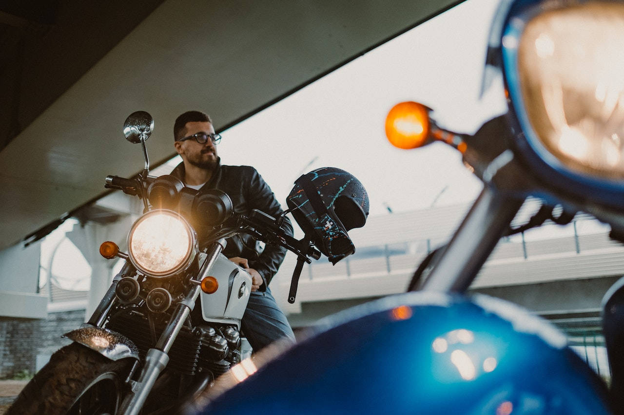 Speed Thrills: Bike Rider On A Black Motorcycle Wallpaper