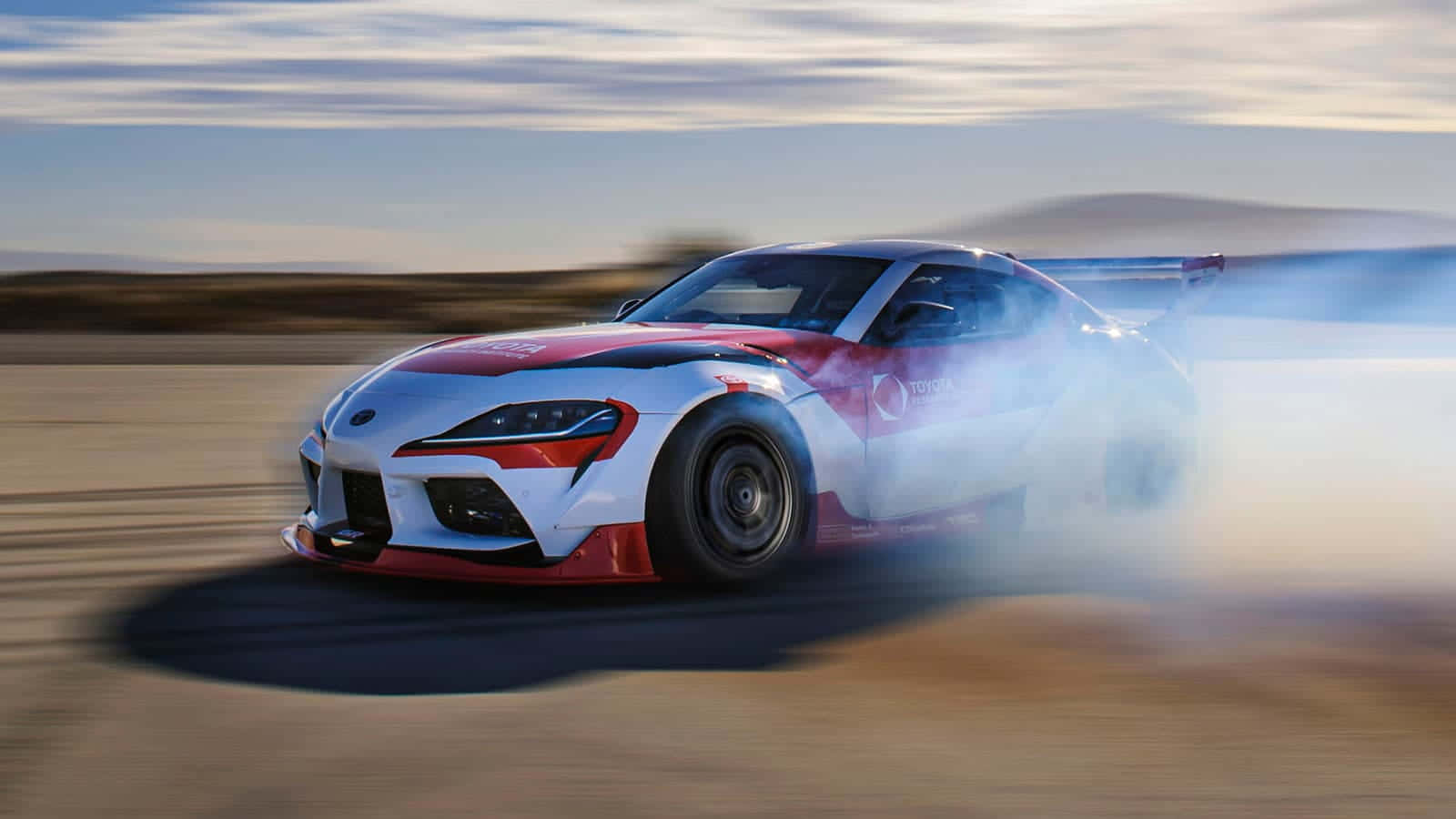 Speed Through The Roads With The Supra Drift Wallpaper