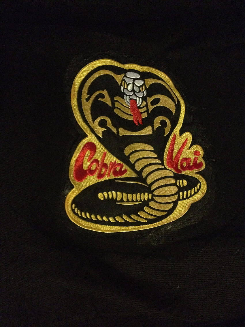 Stay Connected And Ready For A Brawl With The Cobra Kai Phone Wallpaper