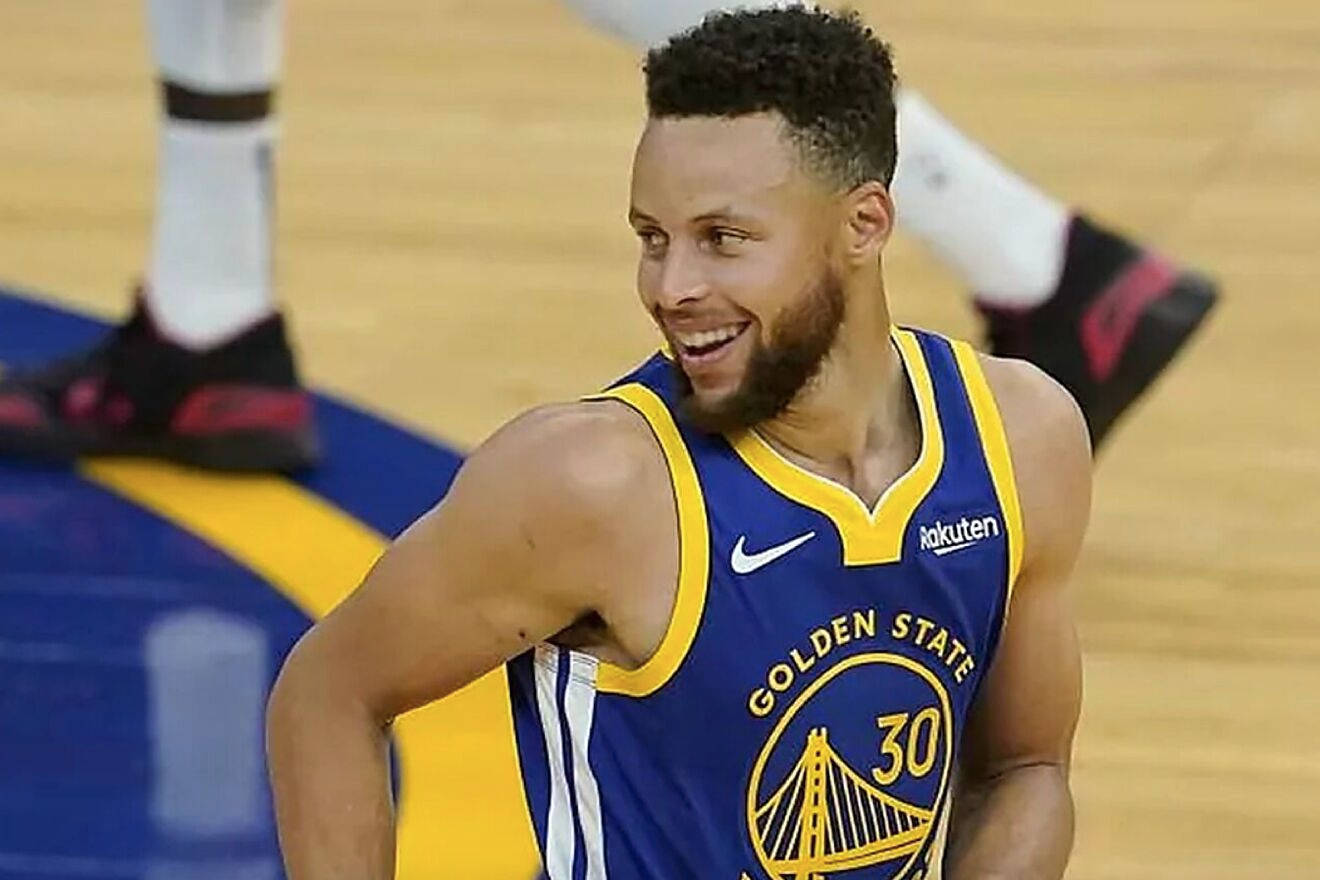 Steph Curry Smiling And Looking At Side Wallpaper