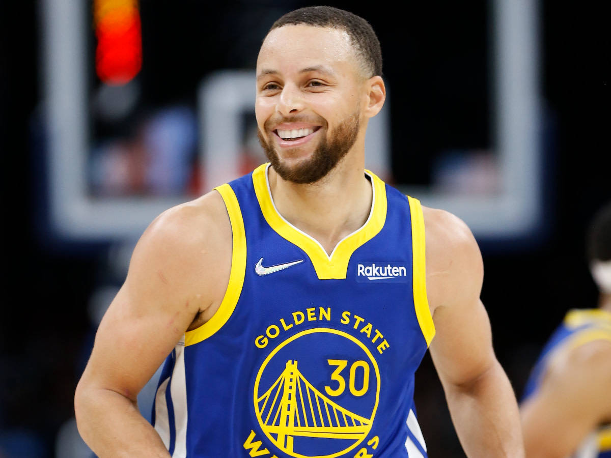 Steph Curry With Beaming Smile Wallpaper