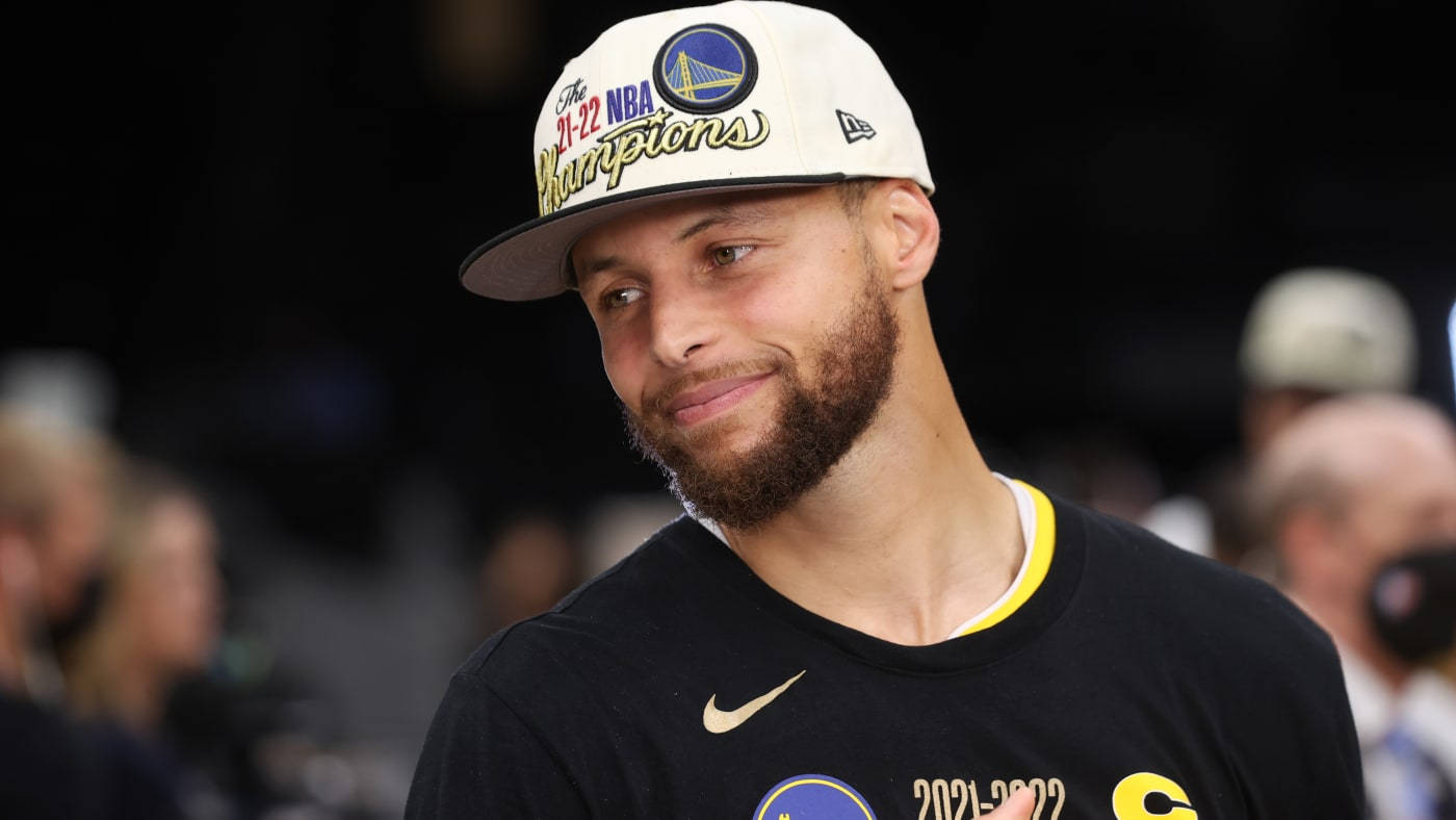 Steph Curry With Warriors Cap Wallpaper