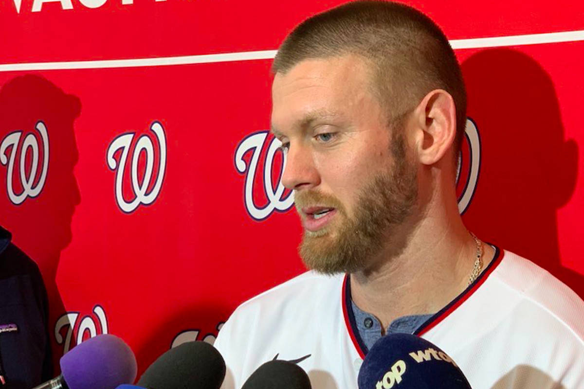 Stephen Strasburg Being Interviewed Red Background Wallpaper