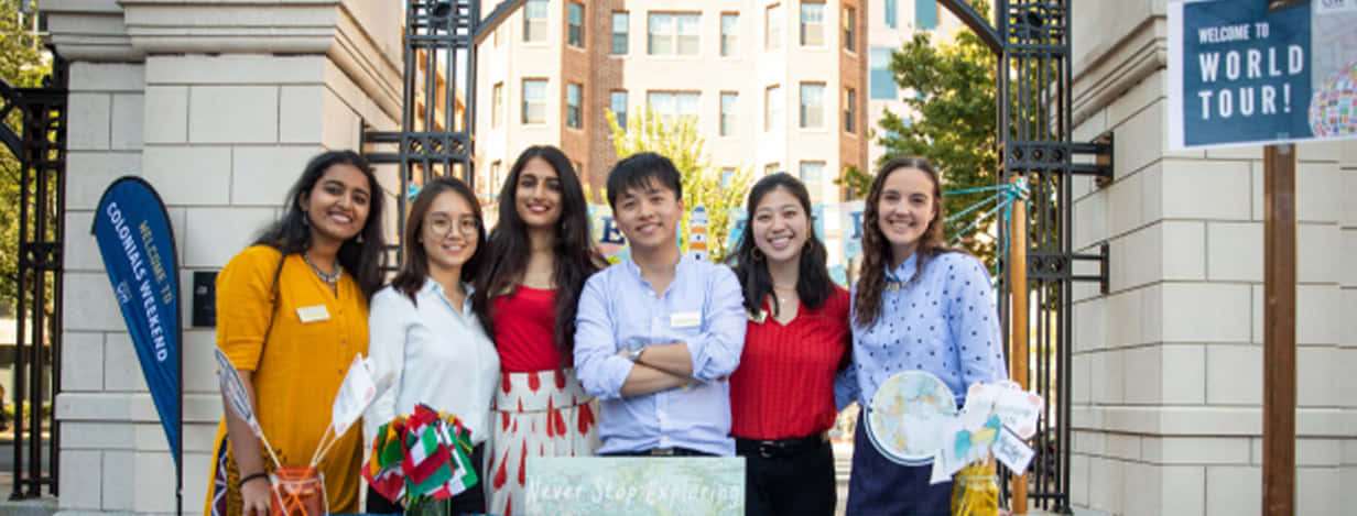 Students Smiling At George Washington University Gate Wallpaper