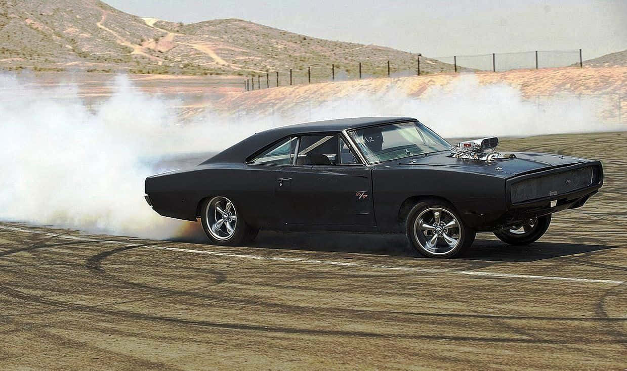 Stunning Dodge Charger In Midnight Blue Speeding On An Open Road Wallpaper