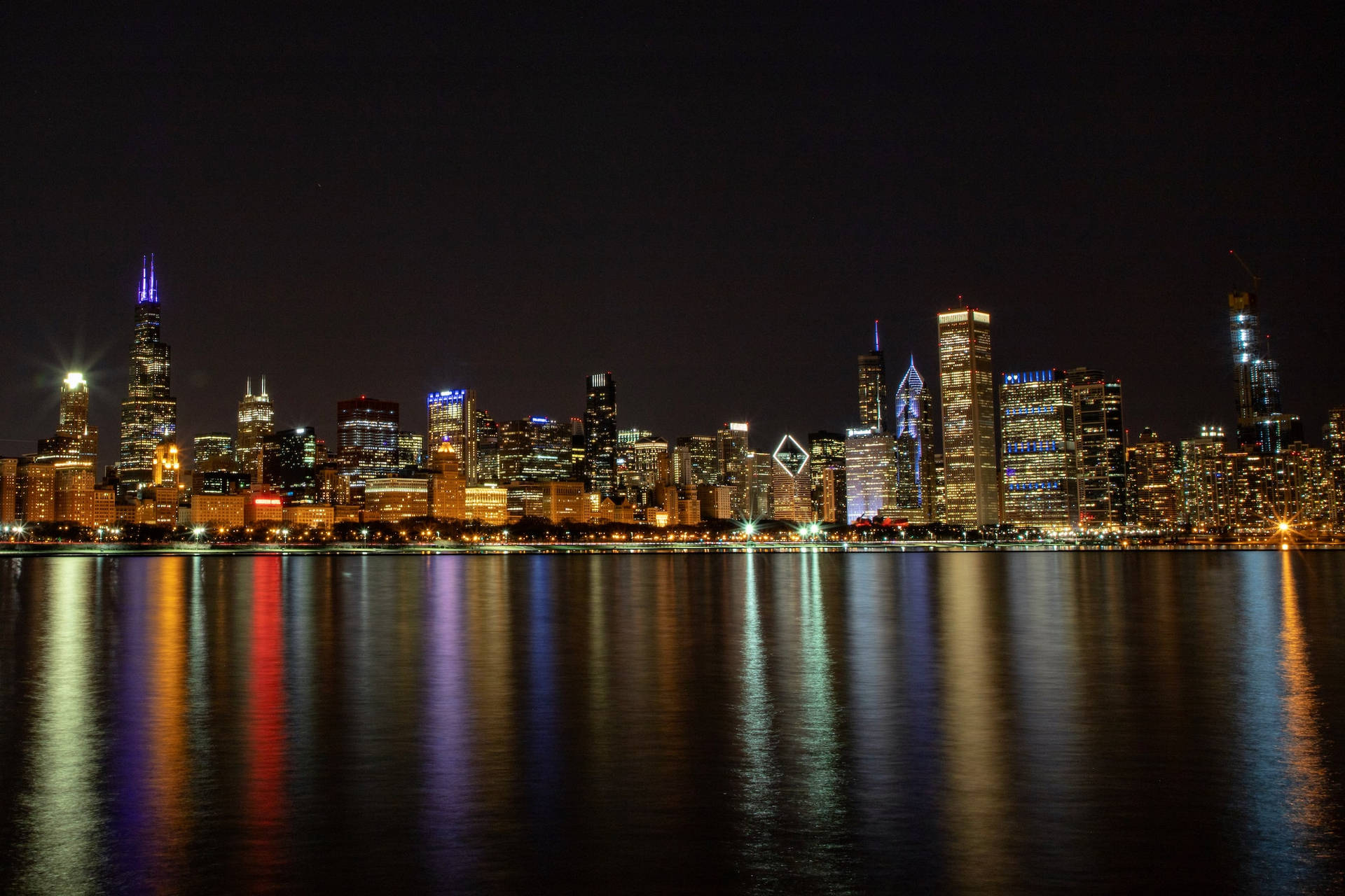 Stunning Midnight View Of The Chicago Skyline Wallpaper